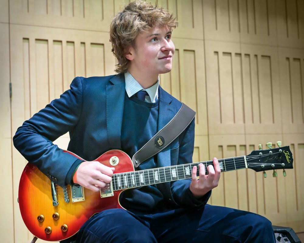 Pupil in music class at Sherborne UK.