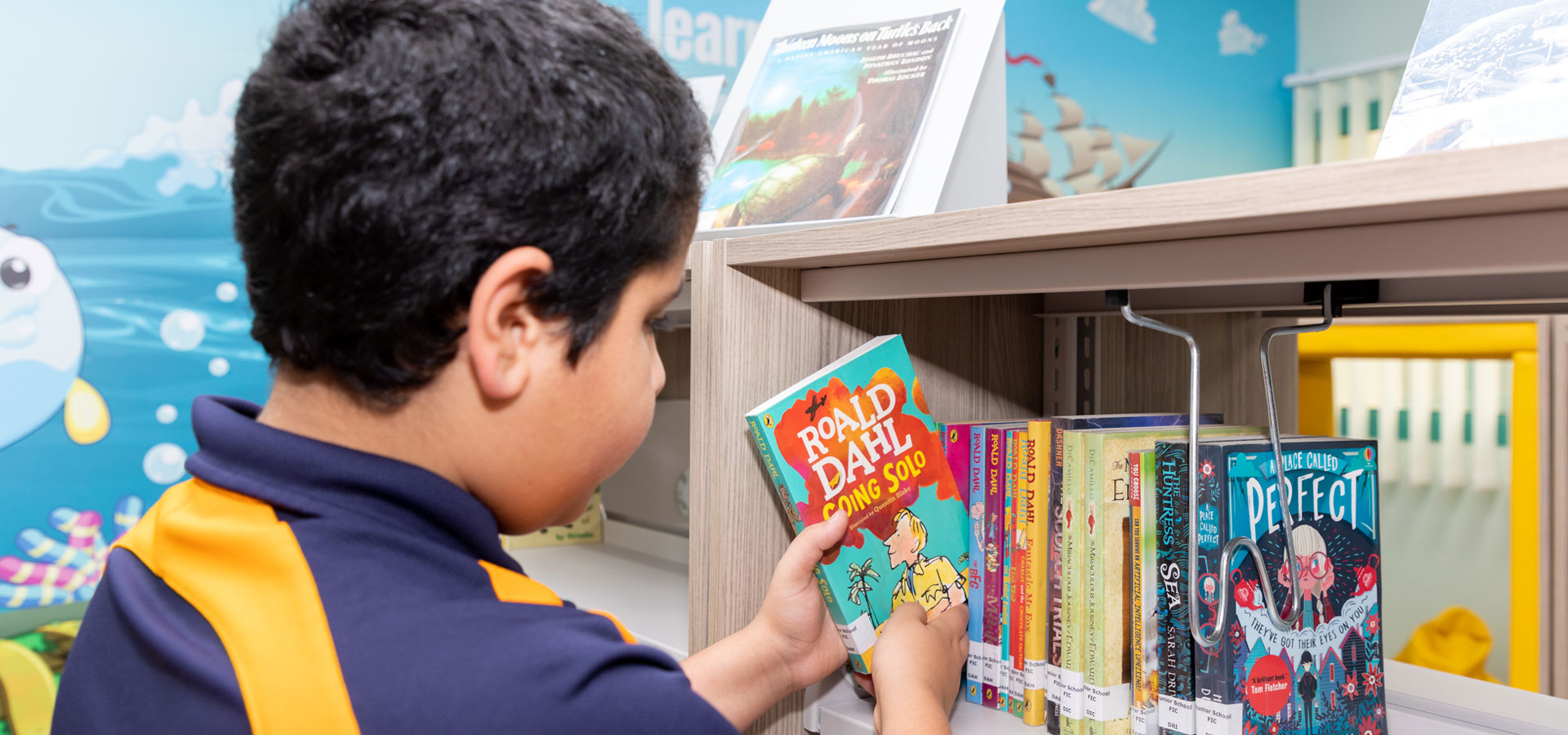 Prep school pupil in the library.