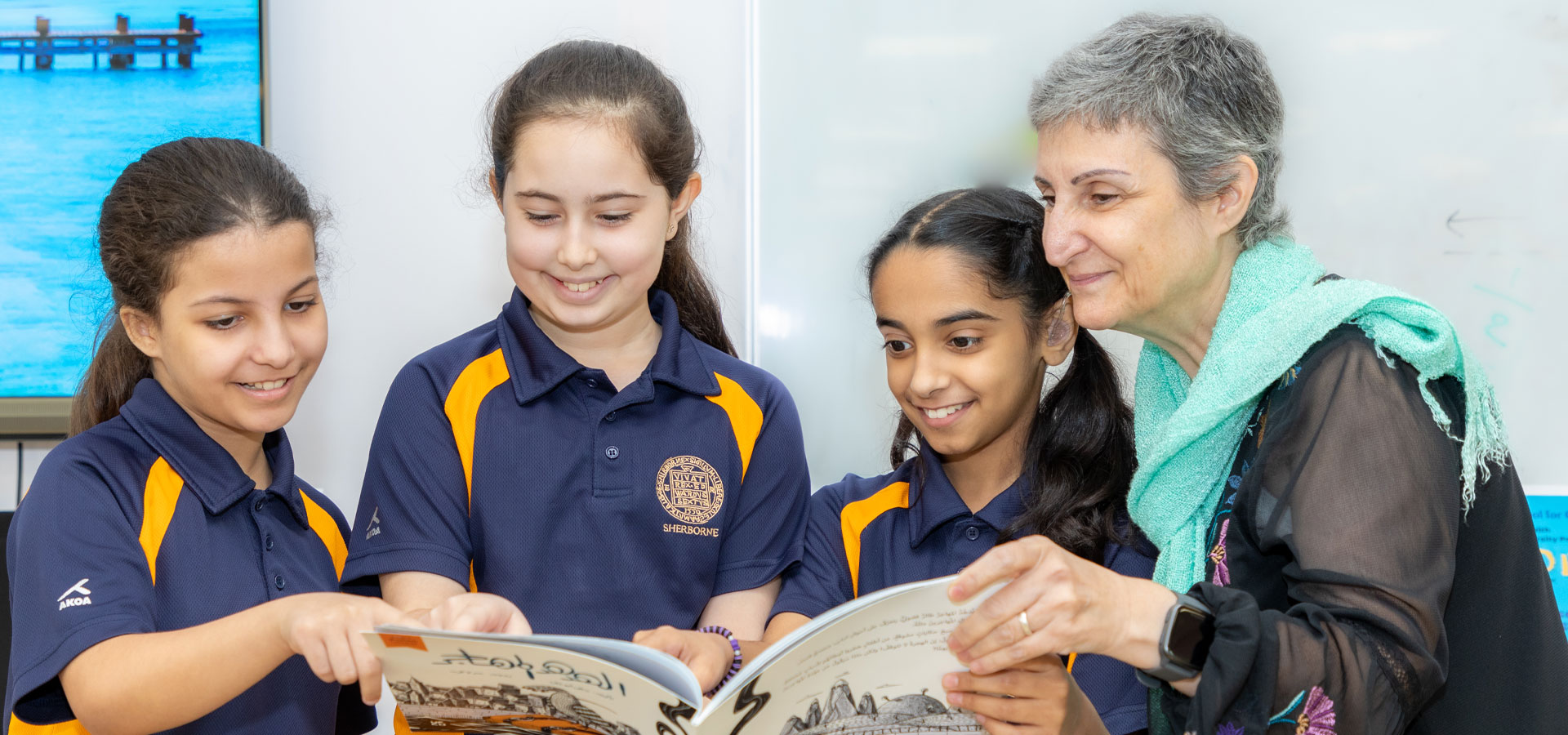 Prep girls' school pupils with a teacher.